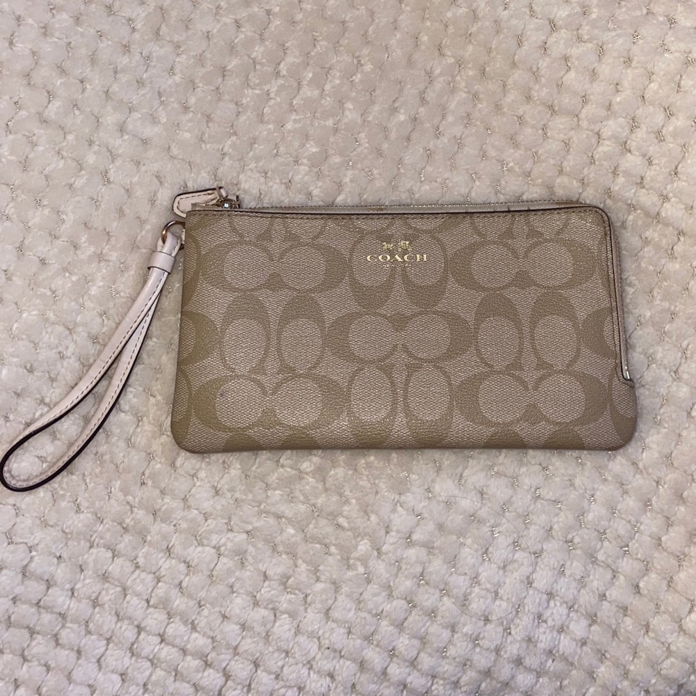 Coach signature print double zip wallet.